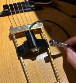 DeArmond screw-on plug to standard 1/4" output jack adapter